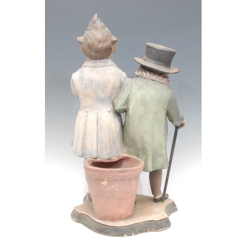 994 - A Victorian terracotta satirical figure group, a pair of politicians as caricatures, painted in poly... 