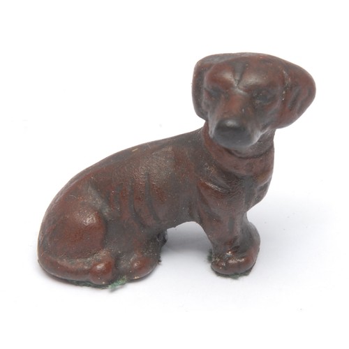 969 - A 19th century Viennese cold-painted bronze dog, a retriever, 3.5cm high; two others similar, as a c... 