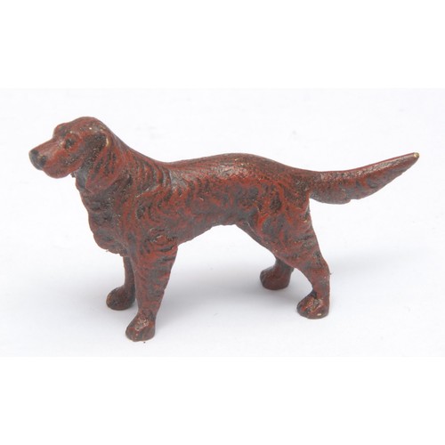 969 - A 19th century Viennese cold-painted bronze dog, a retriever, 3.5cm high; two others similar, as a c... 