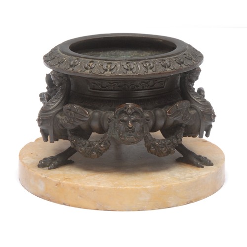 975 - A George II style bronze urn, the gadrooned bowl supported by three zoomorphic creatures, separated ... 