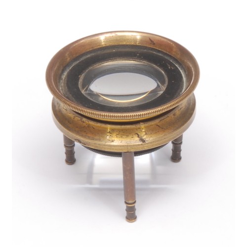 215 - Cartography - a lacquered brass tripod map reading lens, 4.75cm diam, 19th/early 20th century