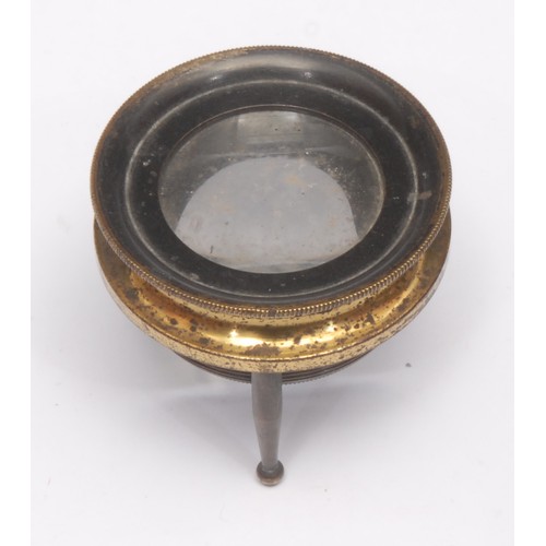 216 - Cartography - a lacquered brass tripod map reading lens, 5cm diam, 19th/early 20th century