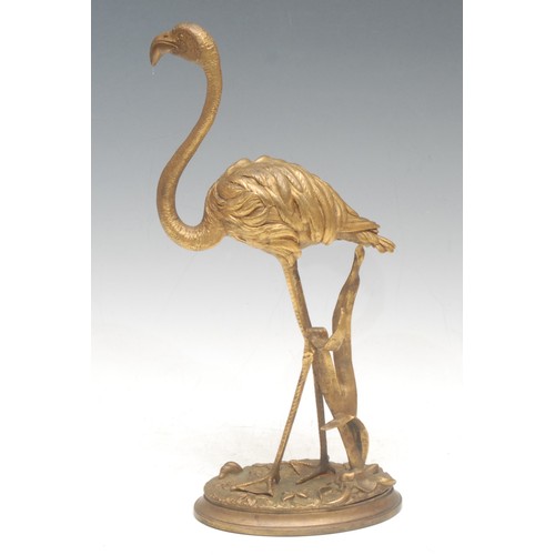 966 - A 19th century Continental gilt bronze, as a flamingo standing guardant, oval base, 32cm high overal... 