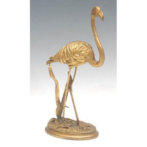 966 - A 19th century Continental gilt bronze, as a flamingo standing guardant, oval base, 32cm high overal... 