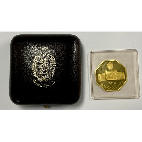 238 - An Iranian 22ct gold octagonal coin, The 50 Years Pahlavi Dynasty, Iranian date 2525, year of the co... 