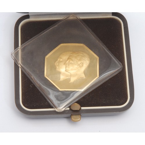 238 - An Iranian 22ct gold octagonal coin, The 50 Years Pahlavi Dynasty, Iranian date 2525, year of the co... 