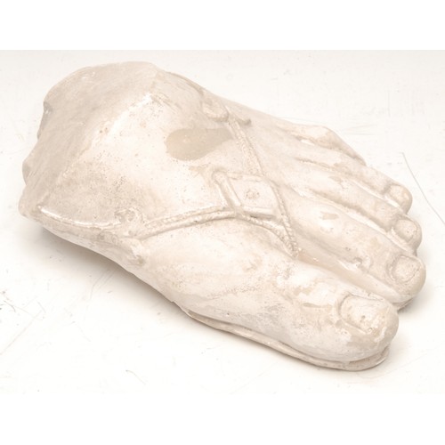 181 - A museum type plaster cast, of a foot wearing a sandal, after the Ancient Greek example collected by... 