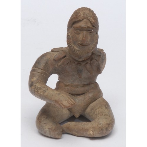 1014 - South American School (19th century), a stoneware figural votive, as a seated deity, 10cm high overa... 