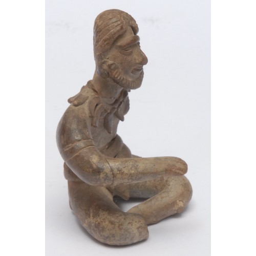 1014 - South American School (19th century), a stoneware figural votive, as a seated deity, 10cm high overa... 