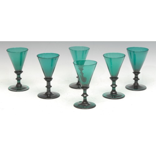 1005 - Glassware - a set of six Regency Bristol green wine glasses, knopped columns, spreading circular bas... 