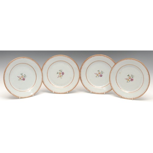 1001 - Ceramics - a set of four Chinese Qianlong period export-ware dinner plates, the central wells painte... 