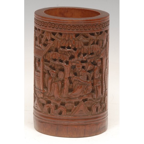 1022 - A 19th/early 20th century Chinese bamboo calligraphy brush pot, carved with scholars among pavilions... 