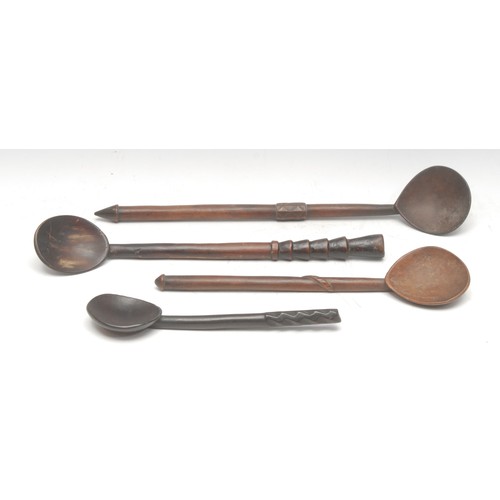 107 - Tribal Art & Treen - an assortment of four South African indigenous hardwood cooking spoons, the lon... 