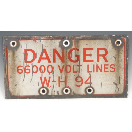 934 - A rectangular enamel sign, 'DANGER 66000 VOLT LINES W.-H. 94', red inscription on white ground, 31cm... 