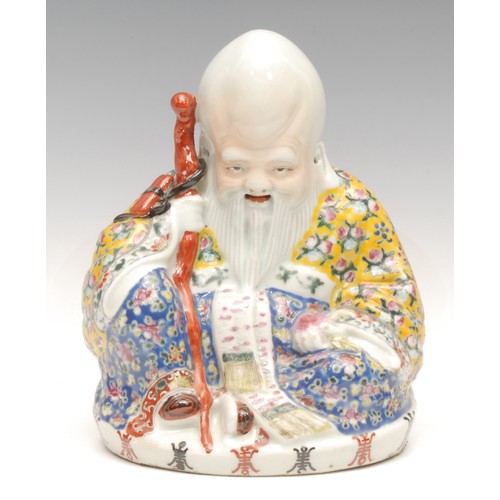 926 - A Chinese Republic period figure, elder with colourful polychrome cloak and staff, 20.5cm, impressed... 