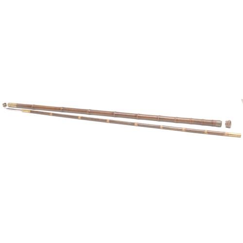 1035 - An early 20th century novelty gadget system walking stick, the bamboo cane enclosing a telescopic fi... 