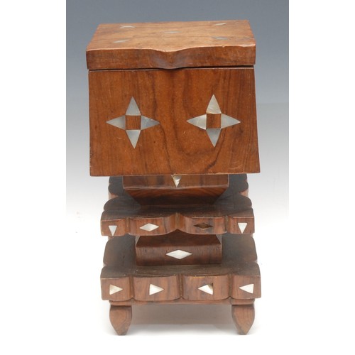 74 - Tribal Art - a Polynesian hardwood rectangular treasure box, of stepped geometric 'totem' form, inla... 