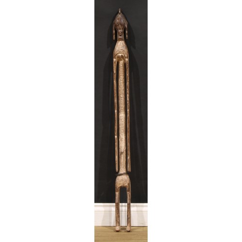 68 - Tribal Art - a Mumuye tutelary figure, of slender and narrow proportions, highly stylised features, ... 