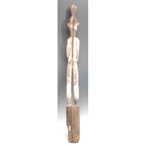 106 - Tribal Art - an Igbo Mmo Society figure, of slender proportions, decorated in white pigment, 100cm h... 