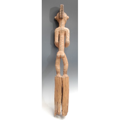 105 - Tribal Art - an Igbo Mmo Society figure, of slender proportions, decorated in earth pigments, 77cm h... 