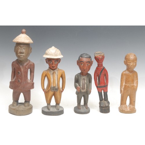 5 - Tribal Art - a Baule Colon figure, depicted in a red European suit and 'Colonial' hat, 30cm high, Iv... 