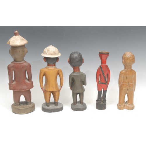 5 - Tribal Art - a Baule Colon figure, depicted in a red European suit and 'Colonial' hat, 30cm high, Iv... 