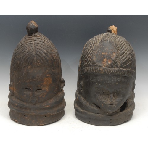 60 - Tribal Art - a Mende helmet mask, 40cm high, Sierra Leone; another (2)