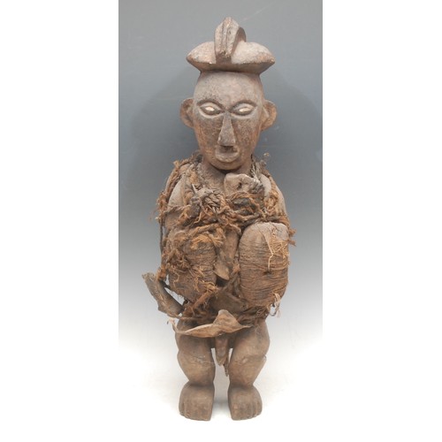 1 - Tribal Art - a  Nkisi/Nkondi fetish figure, painted eyes, adorned with bone fragments and fibres, 58... 