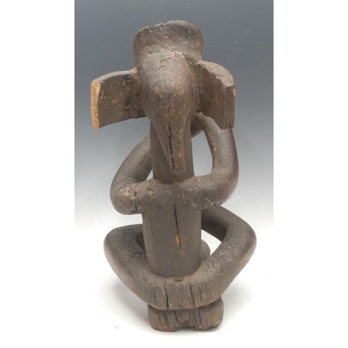 17 - Tribal Art - a Chokwe figure, Chibinda Ilunga, depicted seated, 46cm high, Angola