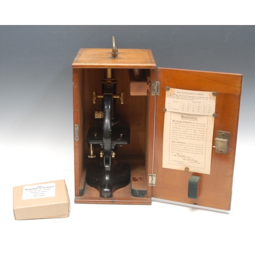 213 - A black painted and lacquered brass monocular microscope, by Charles Perry, London, no.4882, rack an... 