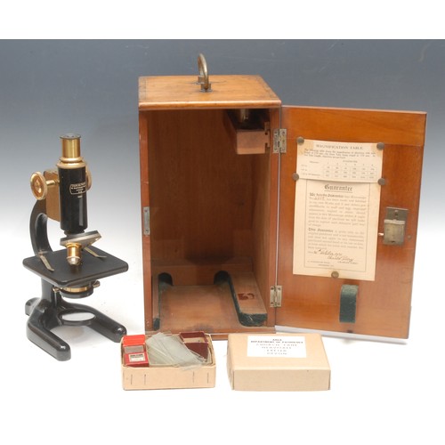 213 - A black painted and lacquered brass monocular microscope, by Charles Perry, London, no.4882, rack an... 