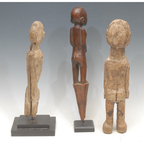 52 - Tribal Art - a Lobi figure, 33cm high, Burkina Faso; another, 29cm high, collector's display stand; ... 