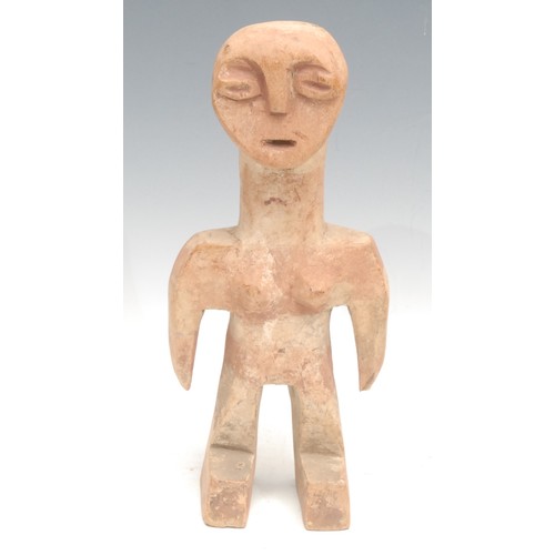 27 - Tribal Art - a Ewe figure, highly stylised features, traces of red surface decoration, 27cm high, To... 