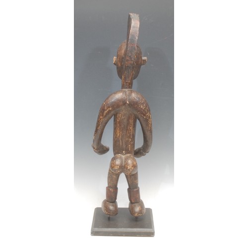 96 - Tribal Art - an Afo figure, he stands, with elavborate coiffure, picked out with traces of red pigme... 