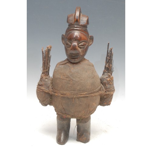 89 - Tribal Art - a Yaka m'bwoolo fetish figure, stylised features with upturned nose, bound in cloth and... 