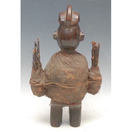 89 - Tribal Art - a Yaka m'bwoolo fetish figure, stylised features with upturned nose, bound in cloth and... 