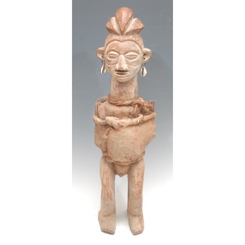 86 - Tribal Art - a Yaka fetish figure, he stands, cloth bound and decorated with earth pigments, 54cm hi... 