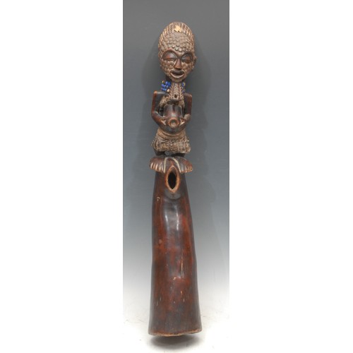 56 - Tribal Art - a Luba figural oliphant, adorned with beadwork, 67cm long, Democratic Republic of Congo