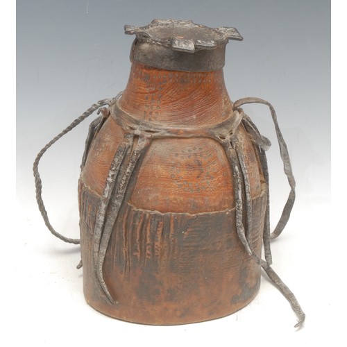 79 - Tribal Art - a Somalian/Ethiopian hide milk vessel, 25cm high