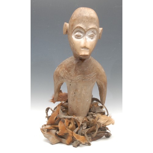 85 - Tribal Art - a West African zoomorphic headdress, simian figural cresting, the features picked out i... 