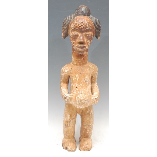 75 - Tribal Art - a Punu figure, elaborate coiffure, 'kaolin' surface, 44cm high, Gabon