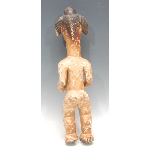 75 - Tribal Art - a Punu figure, elaborate coiffure, 'kaolin' surface, 44cm high, Gabon