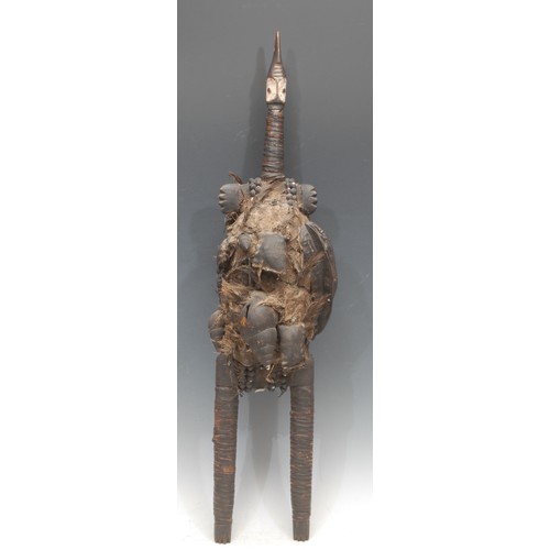 97 - Tribal Art - an African fetish figure, highly stylised, elongated neck, the under-size head picked o... 