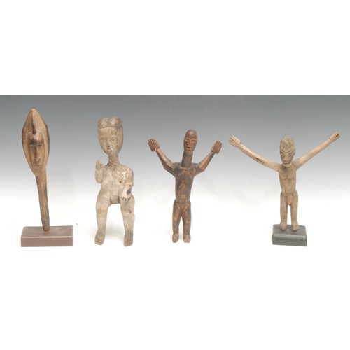 26 - Tribal Art - a Ewe figure, depicted seated, the arms gesturing, traces of white surface pigment, 26c... 