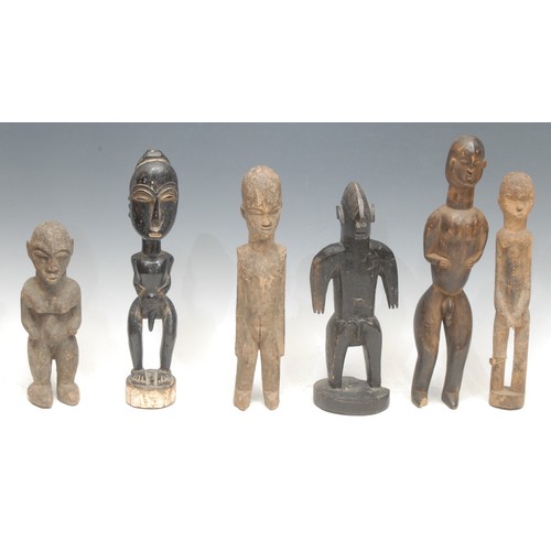 2 - Tribal Art - a Bamana figure, 27cm high, Mali; others, Baule; Lobi; etc (6)