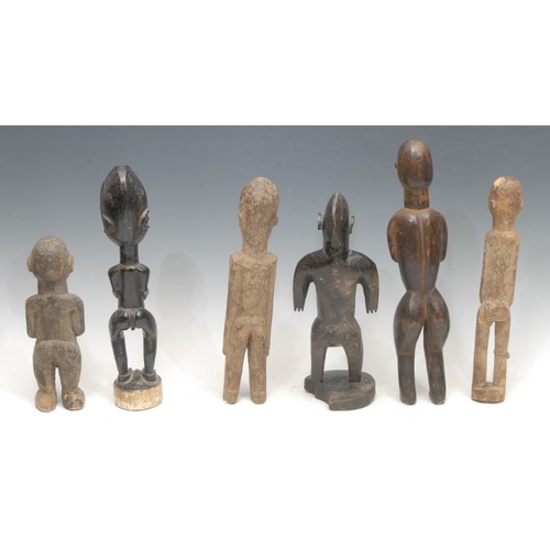 2 - Tribal Art - a Bamana figure, 27cm high, Mali; others, Baule; Lobi; etc (6)