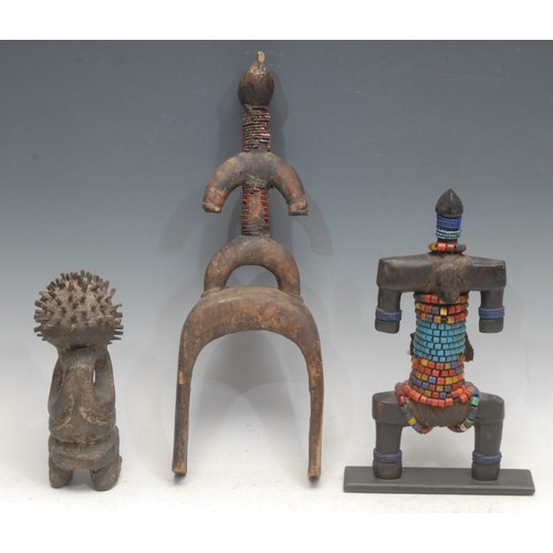 25 - Tribal Art - a Dowayo namchi doll, of typical stylised form, adorned with beadwork, 27.5cm high, Cam... 