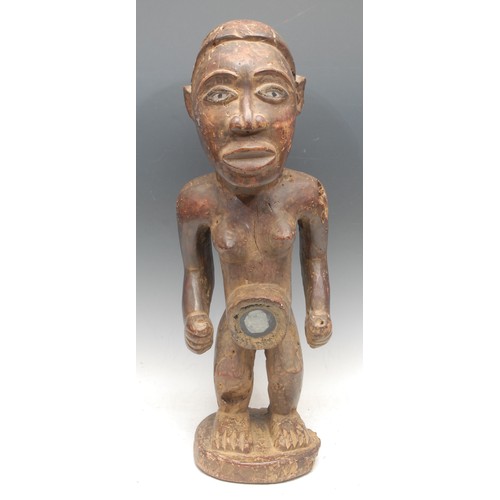 92 - Tribal Art - a Yombe nkisi nkondi power figure, the midriff typically set with a mirror glass panel,... 