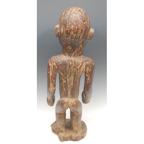 92 - Tribal Art - a Yombe nkisi nkondi power figure, the midriff typically set with a mirror glass panel,... 