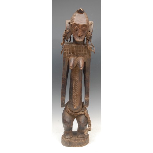 63 - Tribal Art - a Mumuye female figure, of typical elongated proportions, stylised features, cord and f... 